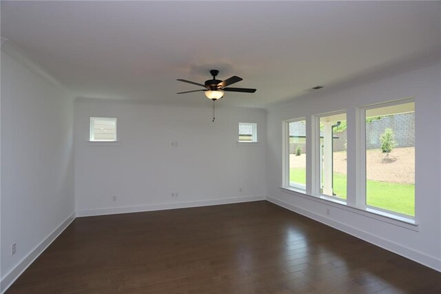 empty room with dark wood-type flooring and ceiling fan