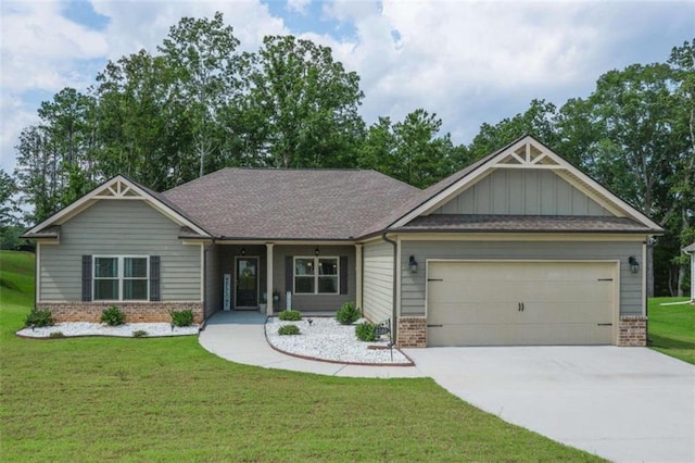 craftsman-style home featuring a front lawn and a garage