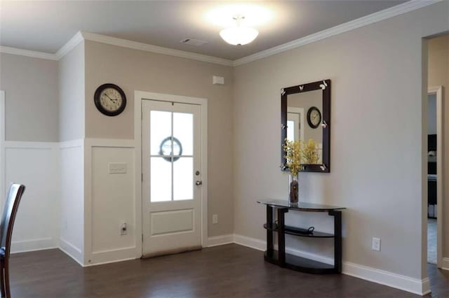 foyer featuring dark hardwood / wood-style flooring and ornamental molding