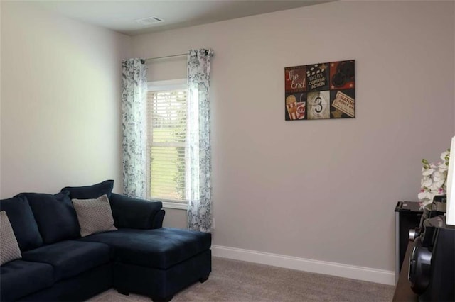 carpeted living room featuring a healthy amount of sunlight