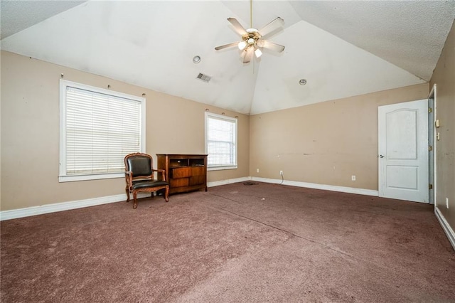 sitting room featuring ceiling fan, vaulted ceiling, and carpet