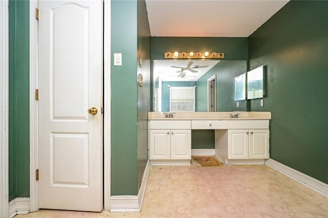 bathroom featuring ceiling fan and vanity