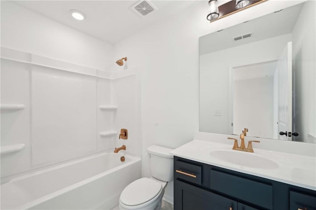 bathroom with washtub / shower combination, toilet, vanity, and visible vents