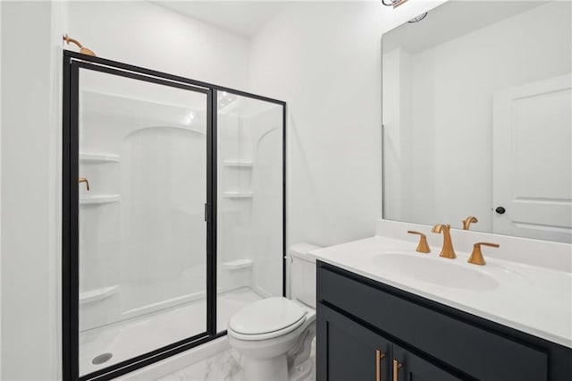 bathroom featuring marble finish floor, a shower stall, toilet, and vanity