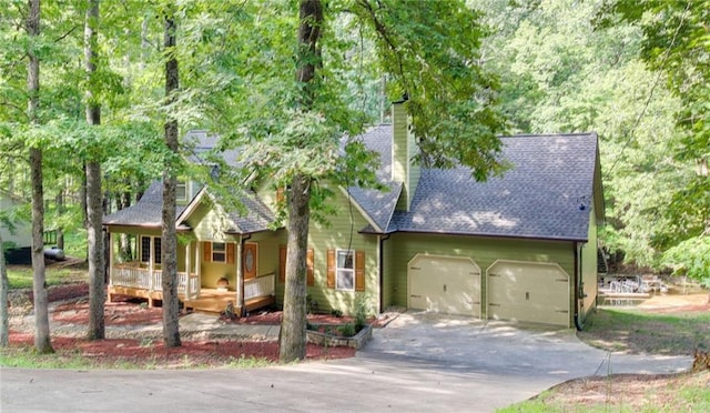 view of front facade featuring a garage and a porch