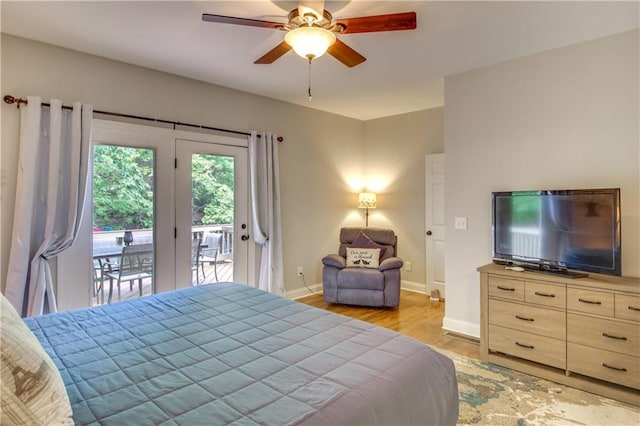 bedroom with ceiling fan, access to exterior, and light hardwood / wood-style floors