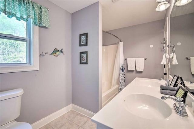 full bathroom with toilet, tile patterned floors, sink, and shower / bathtub combination with curtain