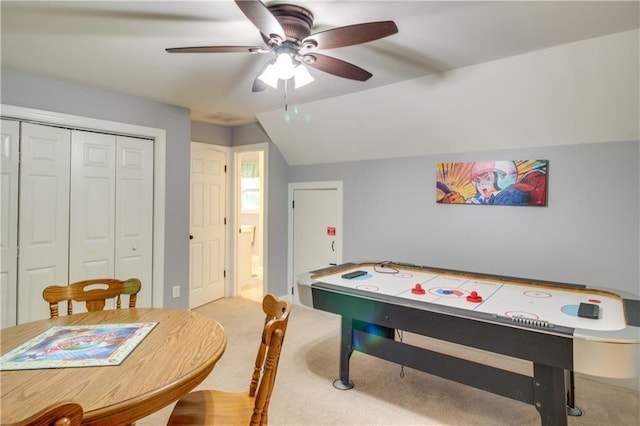 recreation room with light carpet, ceiling fan, and lofted ceiling