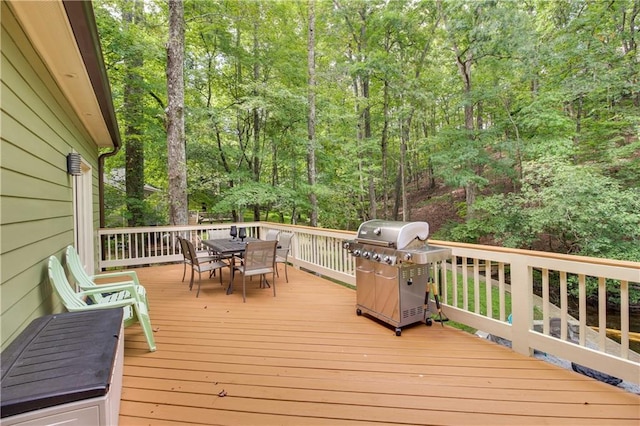 wooden deck featuring area for grilling