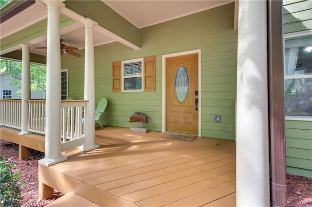 property entrance featuring covered porch and ceiling fan