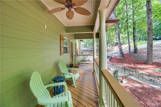 wooden deck with ceiling fan and a porch