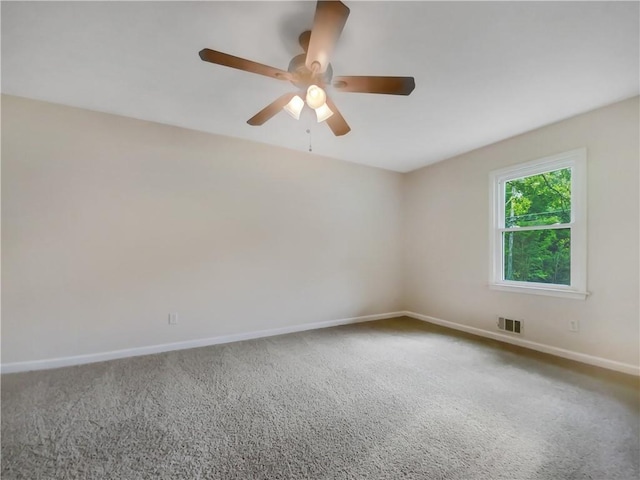 carpeted empty room with ceiling fan