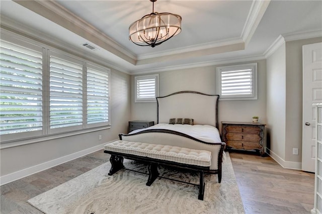 bedroom with an inviting chandelier, a raised ceiling, ornamental molding, and visible vents