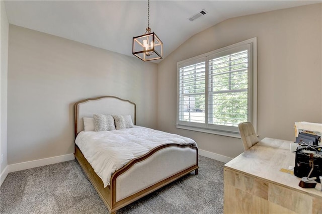 carpeted bedroom featuring visible vents, baseboards, a notable chandelier, and vaulted ceiling
