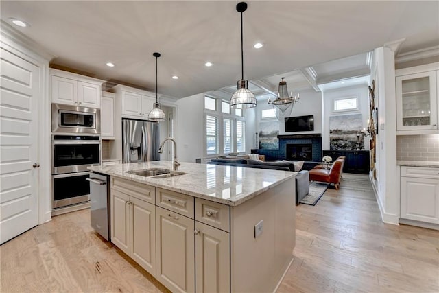 kitchen featuring plenty of natural light, a sink, recessed lighting, and stainless steel appliances