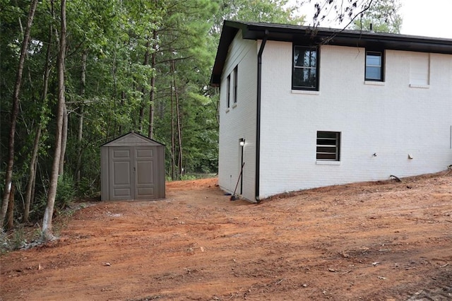 view of property exterior with a shed