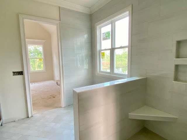 LOT35 Waterview Ct, Newnan, GA 30263 - corridor with healthy amount of natural light, ornamental molding, and light tile patterned floors