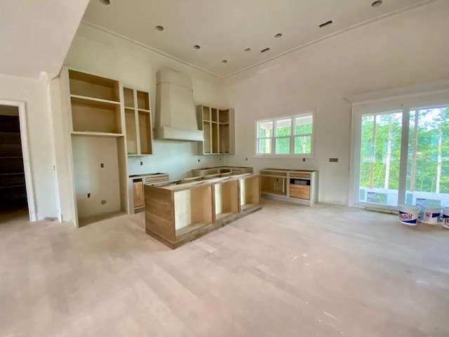 LOT35 Waterview Ct, Newnan, GA 30263 - kitchen with premium range hood, a center island, and crown molding