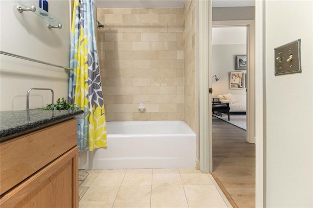 full bathroom with tile patterned floors, shower / bath combo, and vanity