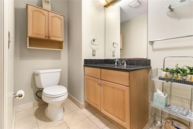 bathroom featuring visible vents, tile patterned flooring, vanity, toilet, and baseboards