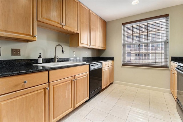 kitchen with stove, dishwasher, a sink, baseboards, and dark stone countertops