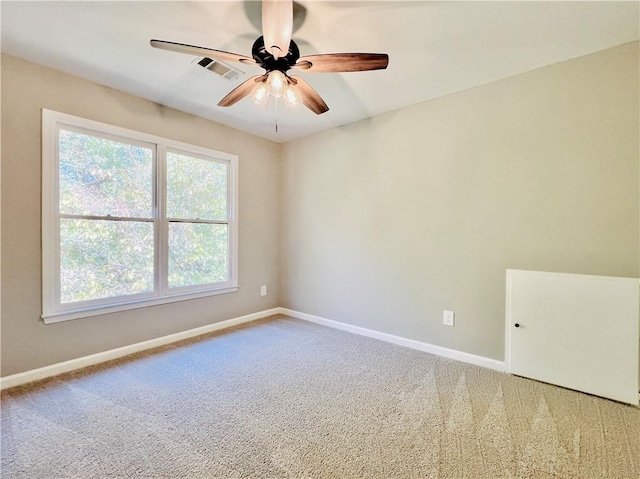 empty room with carpet and ceiling fan