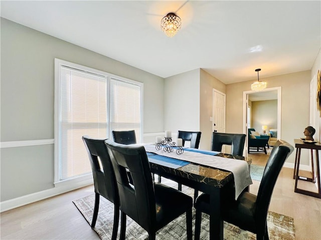 dining space featuring light hardwood / wood-style flooring and a wealth of natural light