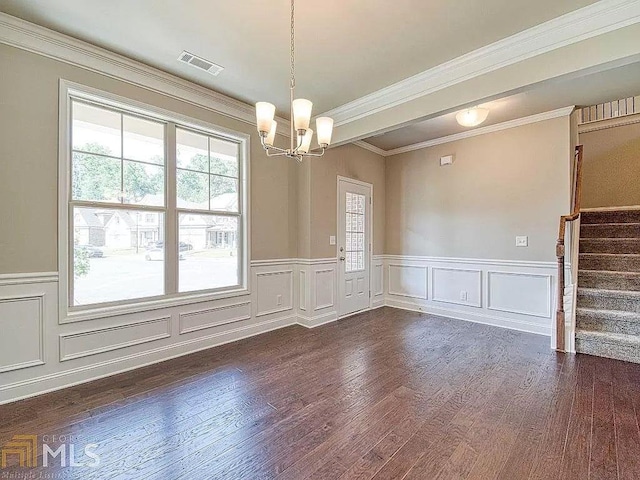 interior space with a notable chandelier, dark wood-type flooring, visible vents, stairs, and ornamental molding