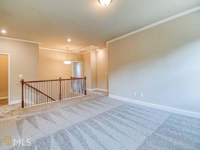 empty room with crown molding, recessed lighting, carpet, and baseboards