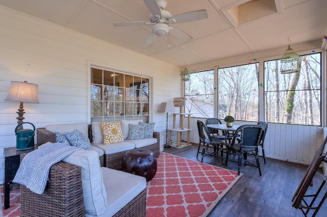 sunroom with a ceiling fan