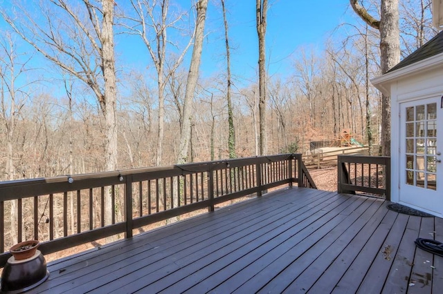 wooden deck with a forest view