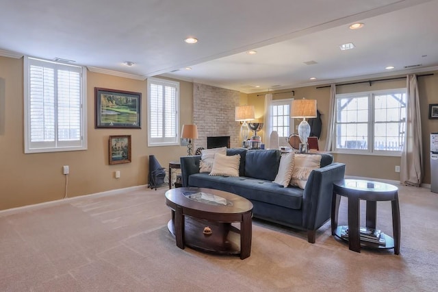 living area featuring a brick fireplace, crown molding, baseboards, light colored carpet, and recessed lighting