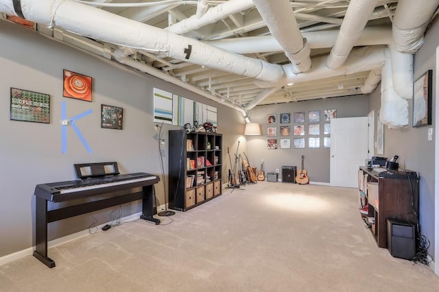 basement featuring baseboards and carpet floors