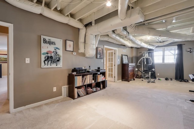 basement featuring carpet and baseboards