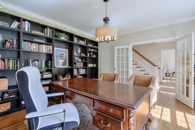 office area featuring french doors, wood finished floors, and crown molding