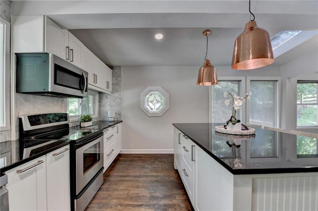 945 Tiber Cir, Alpharetta, GA 30022 - kitchen featuring stainless steel appliances, baseboards, dark wood-style flooring, white cabinets, and tasteful backsplash