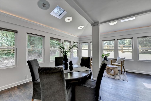 945 Tiber Cir, Alpharetta, GA 30022 - dining area with lofted ceiling, healthy amount of natural light, dark wood-type flooring, a skylight, and baseboards