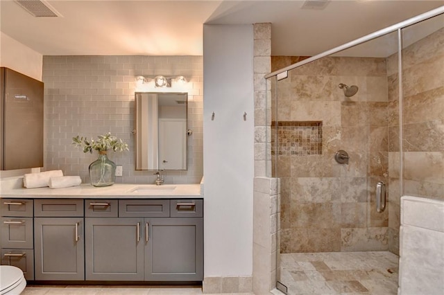 945 Tiber Cir, Alpharetta, GA 30022 - bathroom featuring vanity, a shower stall, toilet, and backsplash