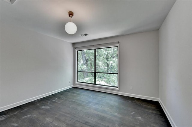 945 Tiber Cir, Alpharetta, GA 30022 - spare room featuring baseboards and dark wood-type flooring