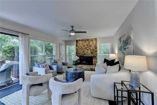945 Tiber Cir, Alpharetta, GA 30022 - living area featuring ceiling fan, a stone fireplace, and wood finished floors