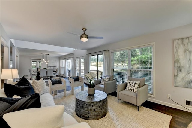 945 Tiber Cir, Alpharetta, GA 30022 - living room featuring baseboards, light wood-style flooring, and a ceiling fan