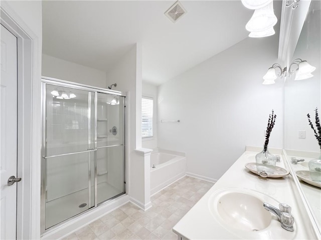2642 Colleen Ln, Dacula, GA 30019 - full bath with a shower stall, a garden tub, double vanity, and baseboards