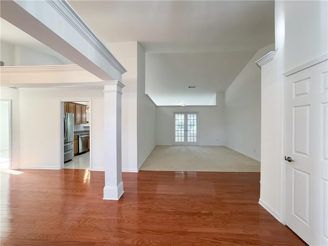 2642 Colleen Ln, Dacula, GA 30019 - spare room featuring ornate columns, light wood-style floors, and baseboards