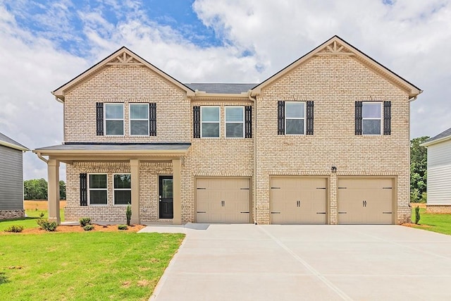 view of front of house with a garage, concrete driveway, brick siding, and a front yard