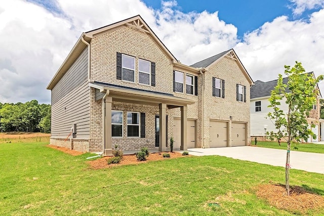 view of front of house featuring a garage, a front yard, concrete driveway, and brick siding