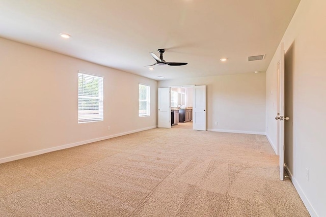 unfurnished bedroom with baseboards, recessed lighting, visible vents, and light colored carpet