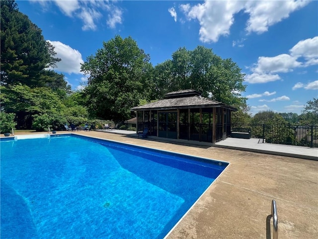 view of swimming pool with a gazebo