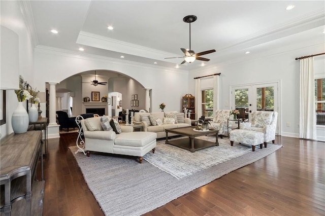 living room featuring dark wood-type flooring, french doors, and ceiling fan