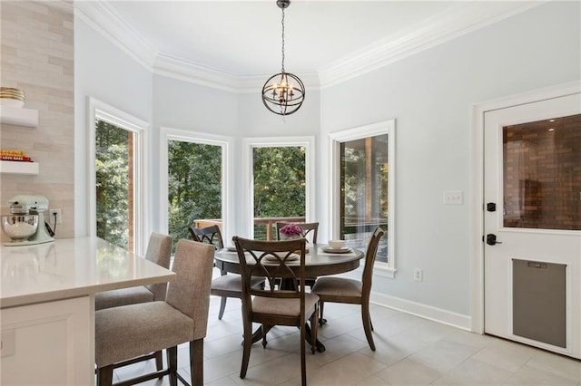 tiled dining area featuring plenty of natural light, ornamental molding, and a notable chandelier