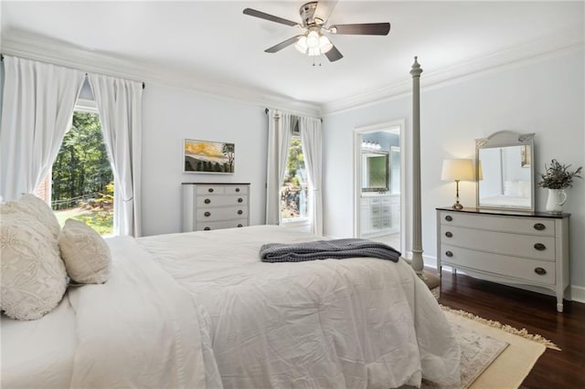 bedroom with dark wood-type flooring, multiple windows, ceiling fan, and ornamental molding